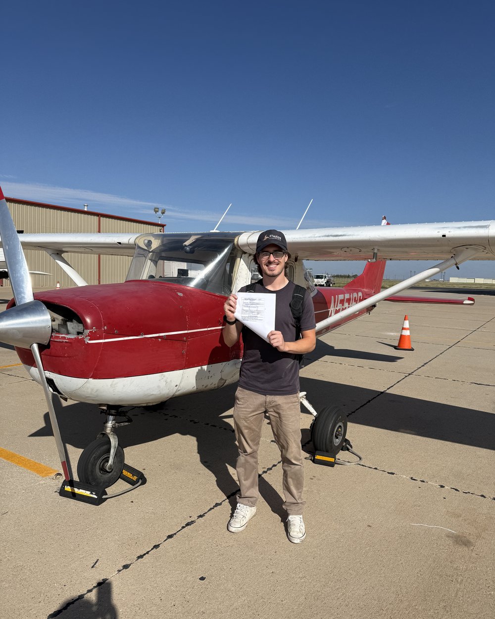 Logan Petree, CFI, with Cessna 150 N5516G